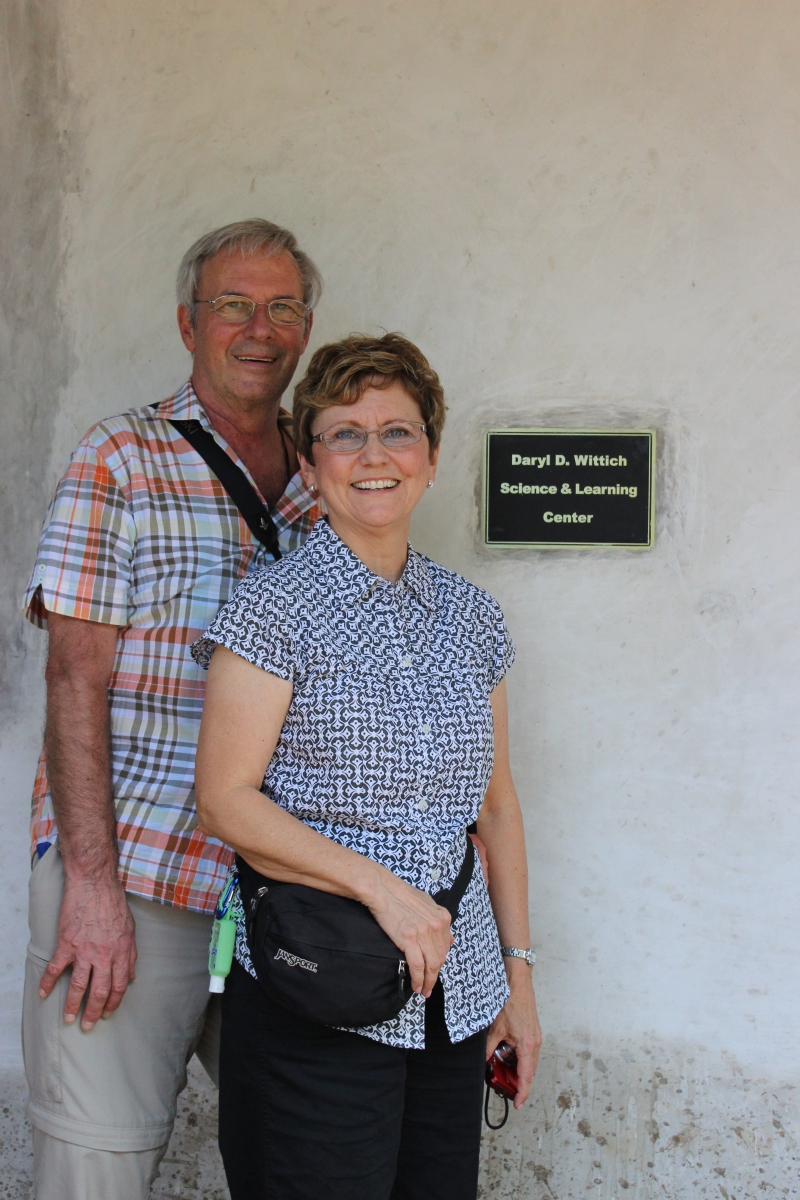 Paul & Nancy in front of the plaque  of the newly dedicated Science Center - Copy - Copy   